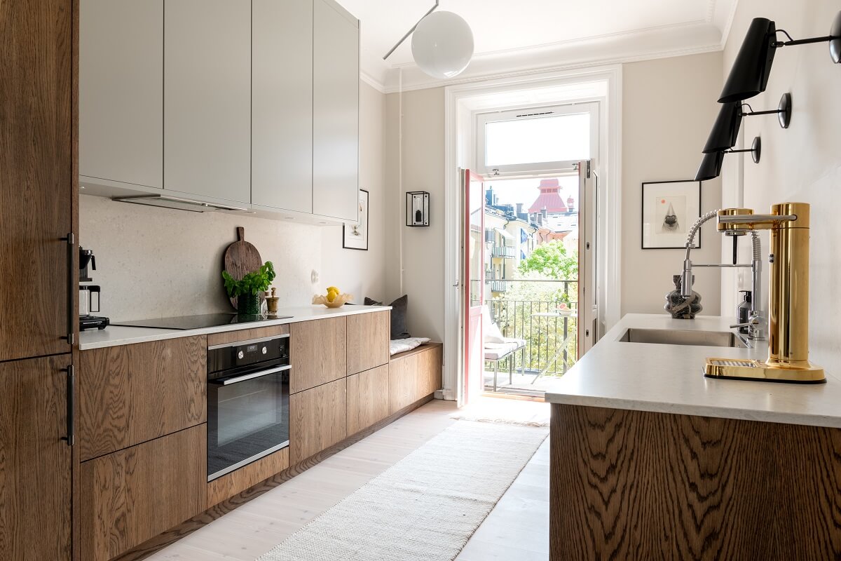 A Light Renovated Apartment in Stockholm 7 wooden kitchen cabinets and balcony
