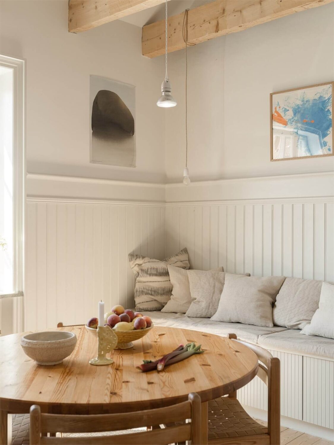 Wooden Details in a Light Duplex Apartment in Sweden 8 wooden kitchen table and storage bench