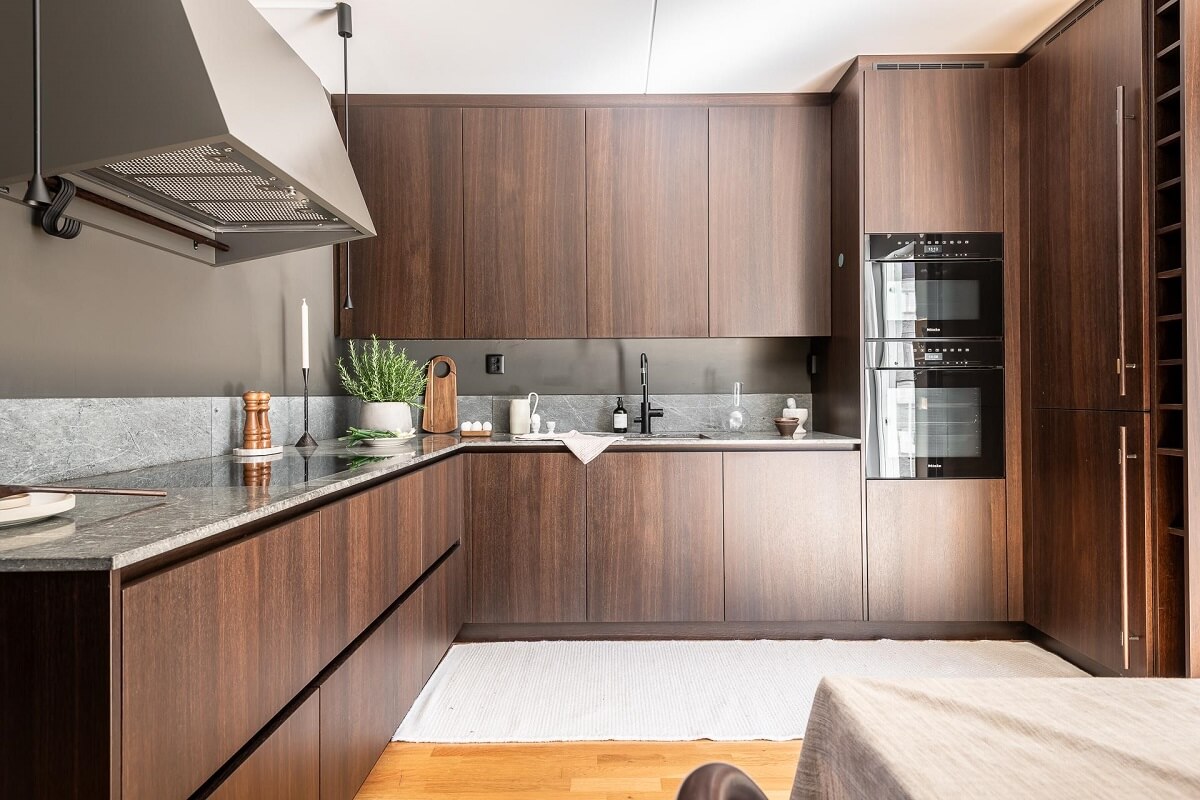 Floor-to-Ceiling Bookcases and Windows in a Loft Style Apartment 12 wooden kitchen with gray walls nordroom
