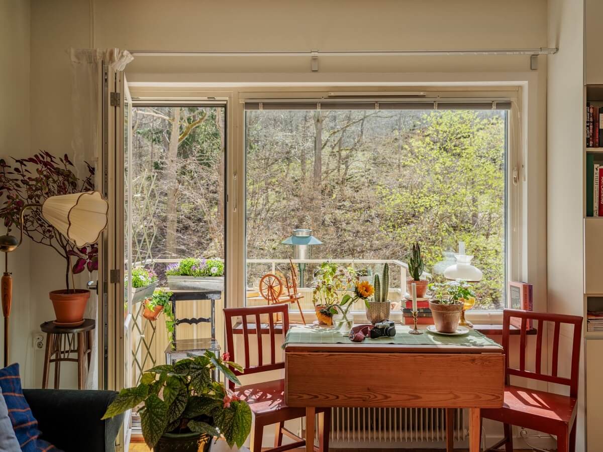 A Studio Apartment with Vintage Green Cabinets 7 wooden table in studio