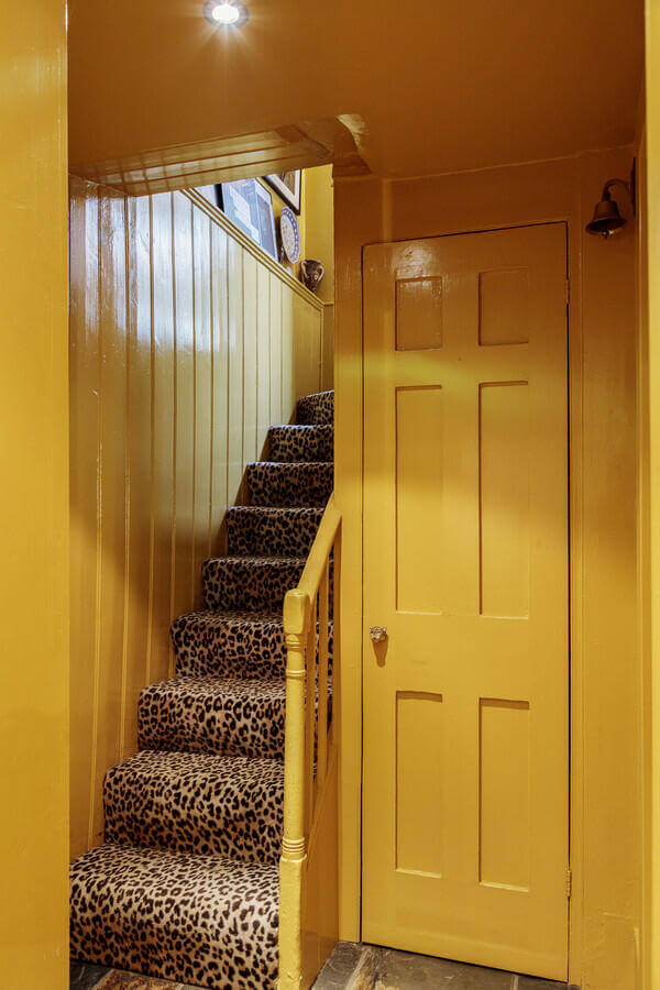 Unique Color Combinations and Design in a London Townhouse 7 yellow hall with panter stairscase