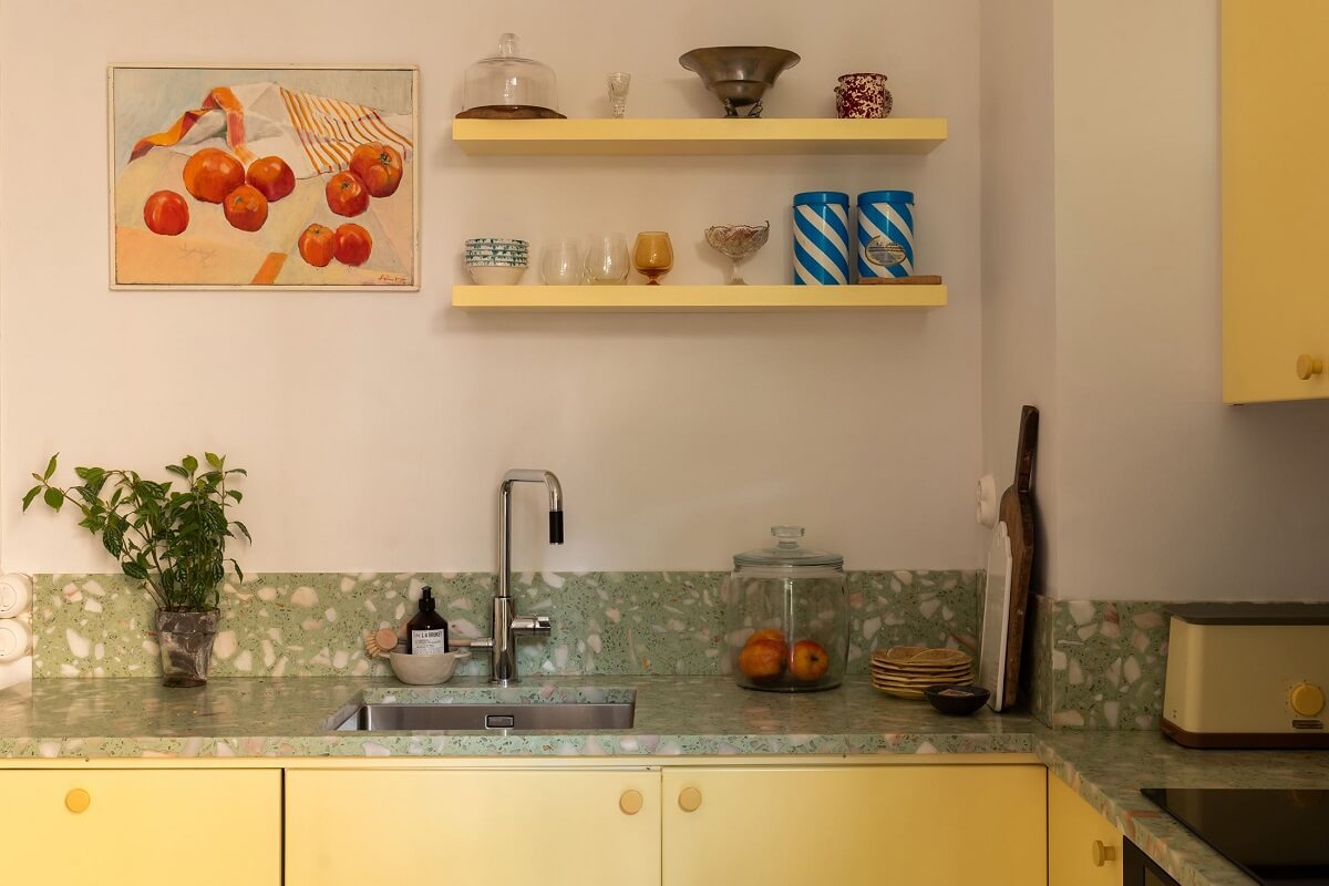 A Swedish Apartment with a Yellow Kitchen 6 yellow shelves and kitchen cabinets