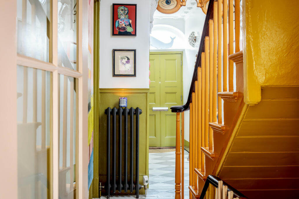 Unique Color Combinations and Design in a London Townhouse 9 yellow staircase