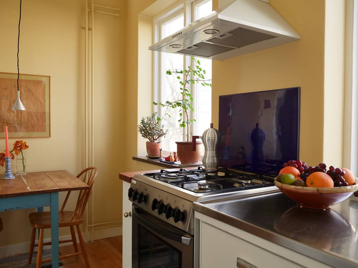 A Swedish Apartment with a Restored Original Kitchen 11 yellow walls in kitchen
