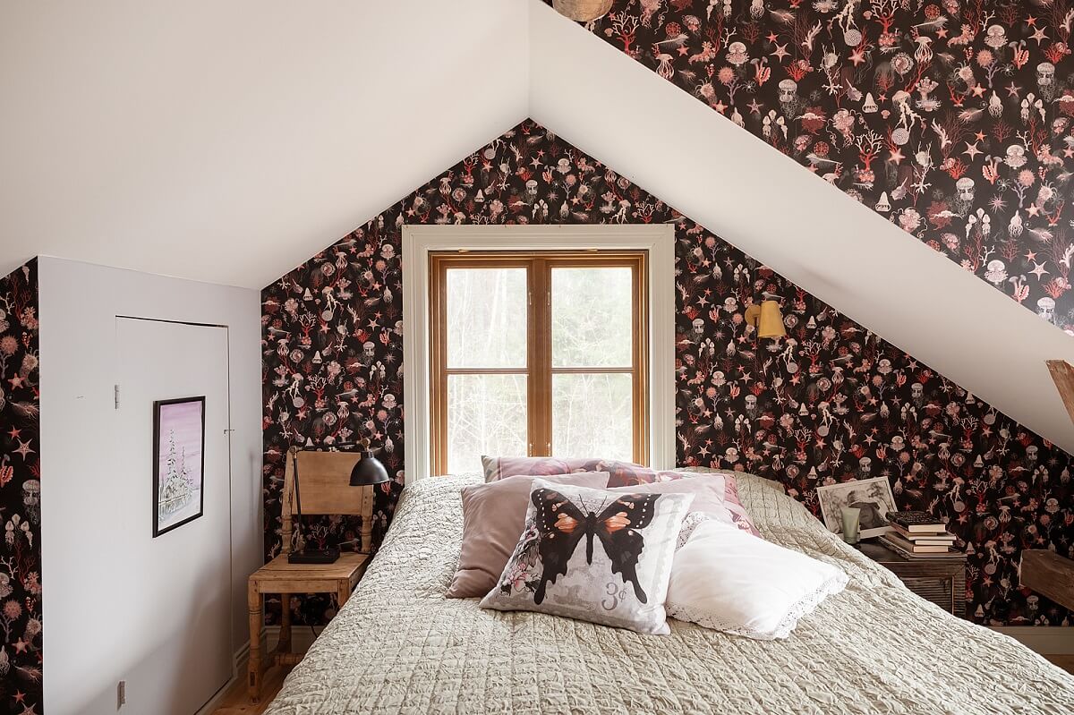 A Charming Historic Home with Views of the Lake 8 attic bedroom with floral wallpaper