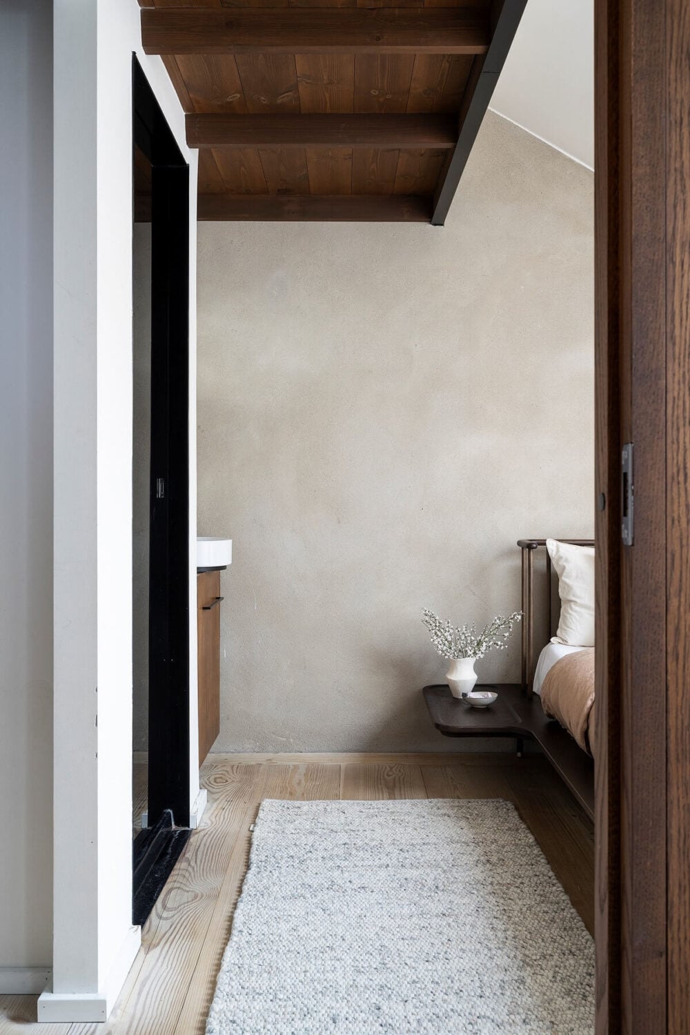 A Stylish Scandinavian Duplex with Custom-Made Cabinets 19 attic bedroom with wooden ceiling