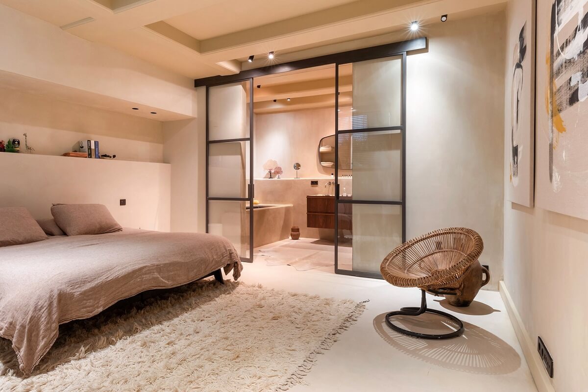 A Luxurious Apartment in an Amsterdam Canal House 22 basement bedroom with sliding industrial glass doors