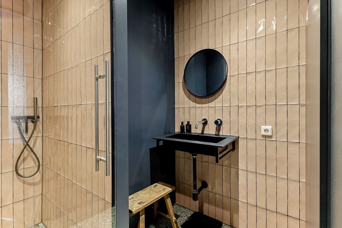 An Amsterdam Apartment with Surprising Bold Color Accents 18 bathroom with light pink tiles