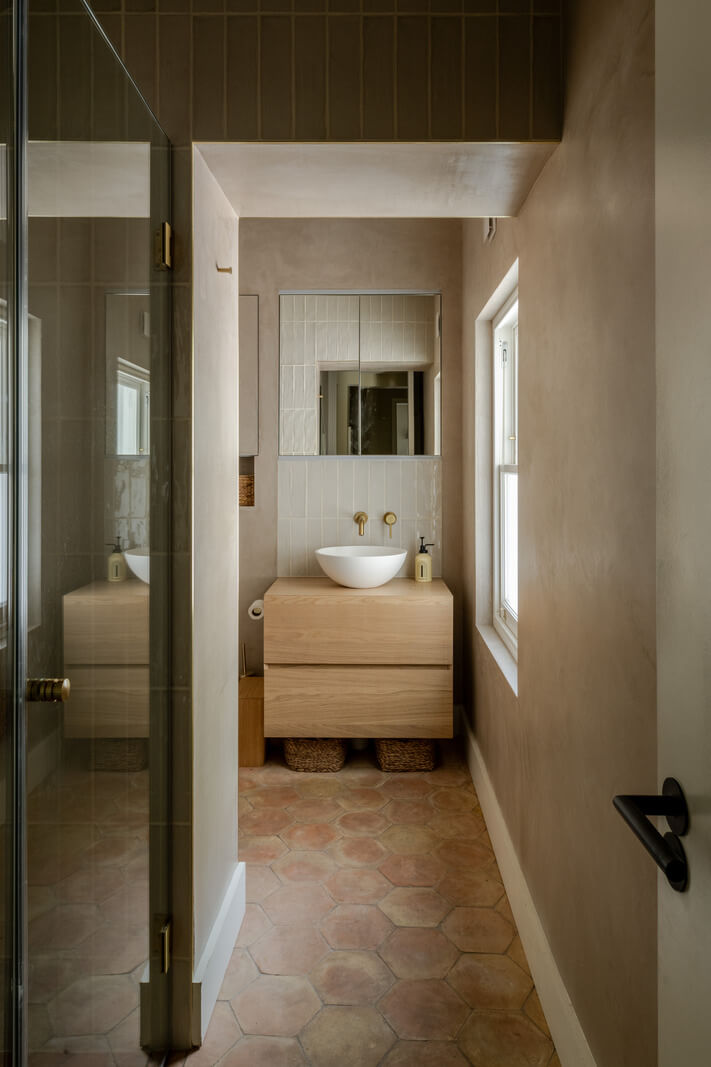 A Green Living Room in a London Maisonette 17 bathroom with stone hexagon floor tiles