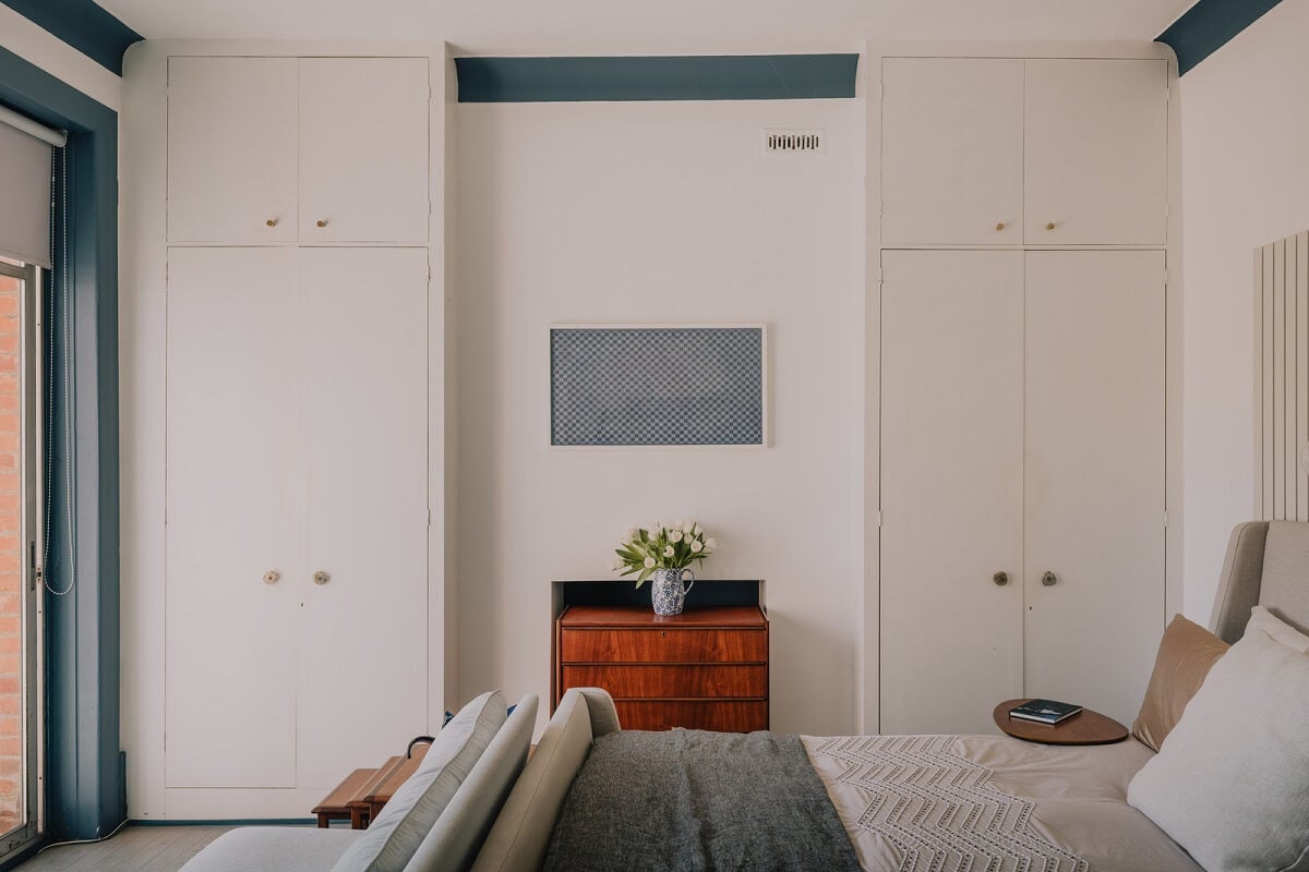 A Deep Blue Color Palette in a London Apartment 14 bedroom with blue woodwork A Deep Blue Color Palette in a London Apartment
