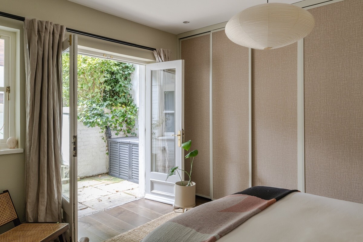 A Green Living Room in a London Maisonette 13 bedroom with floor to ceiling wardrobes
