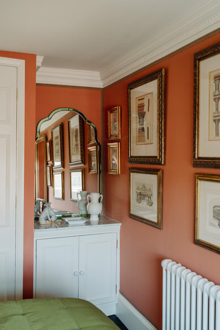 Rich Colors and Patterns in a London Townhouse 21 bedroom with vanity and orange walls