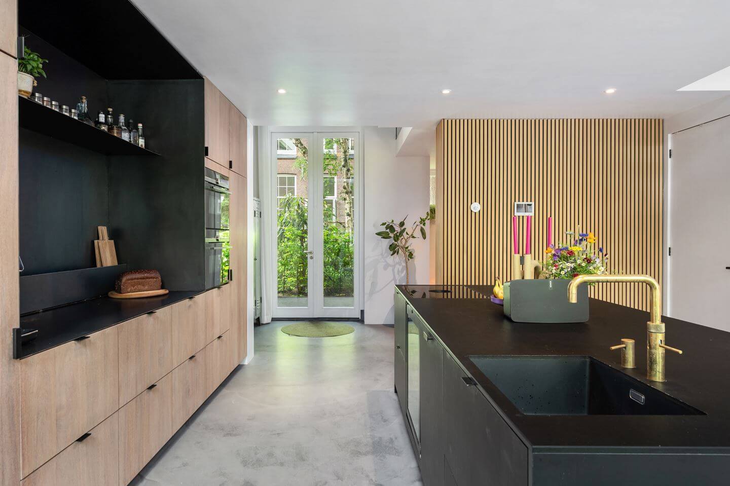 Loft Spaces in a Former School Conversion in Rotterdam 12 black wood kitchen