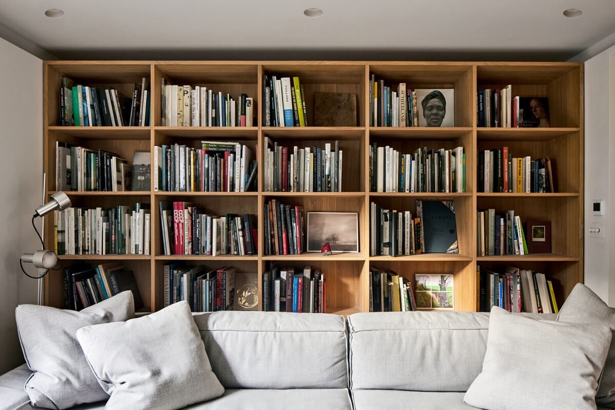 A Georgian Townhouse with a Modern Concrete Extension 20 bookcases behind sofa