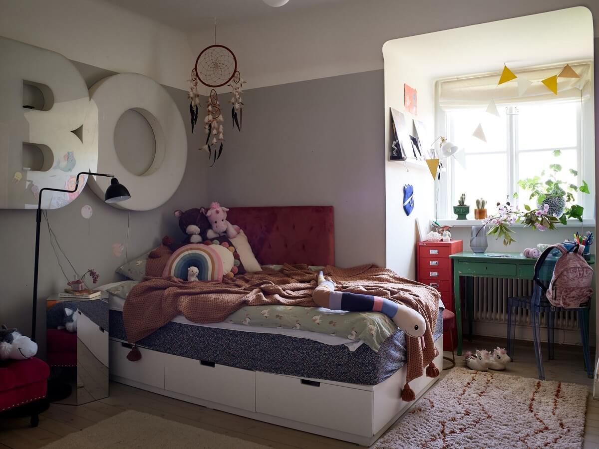 A Cozy Attic Apartment is a Charming Family Home 20 children bedroom with light gray walls and dormer window