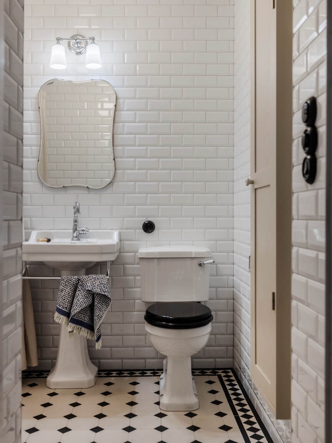 A Light Atmosphere and Wallpapers in a Swedish Apartment 25 classic bathroom black white floor tiles nordroom