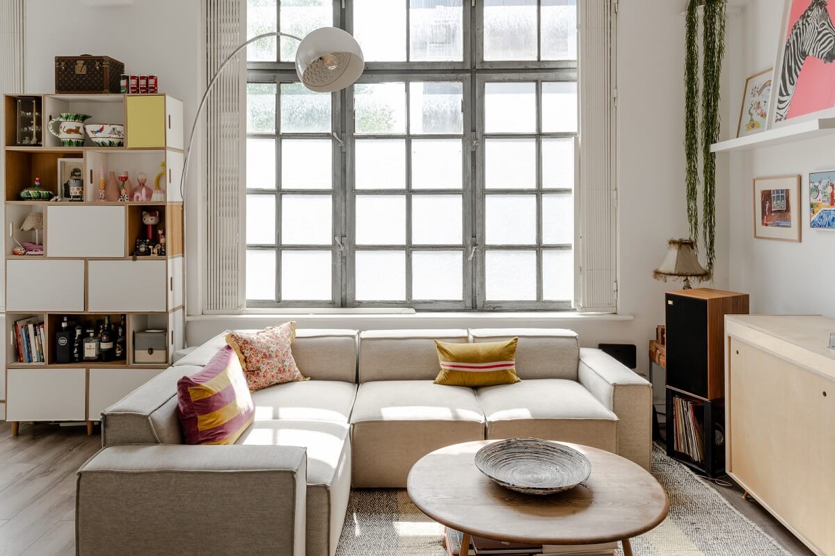 A Modern Scandinavian-Style Apartment in a Former London Mill 2 corner sofa with industrial window london flat