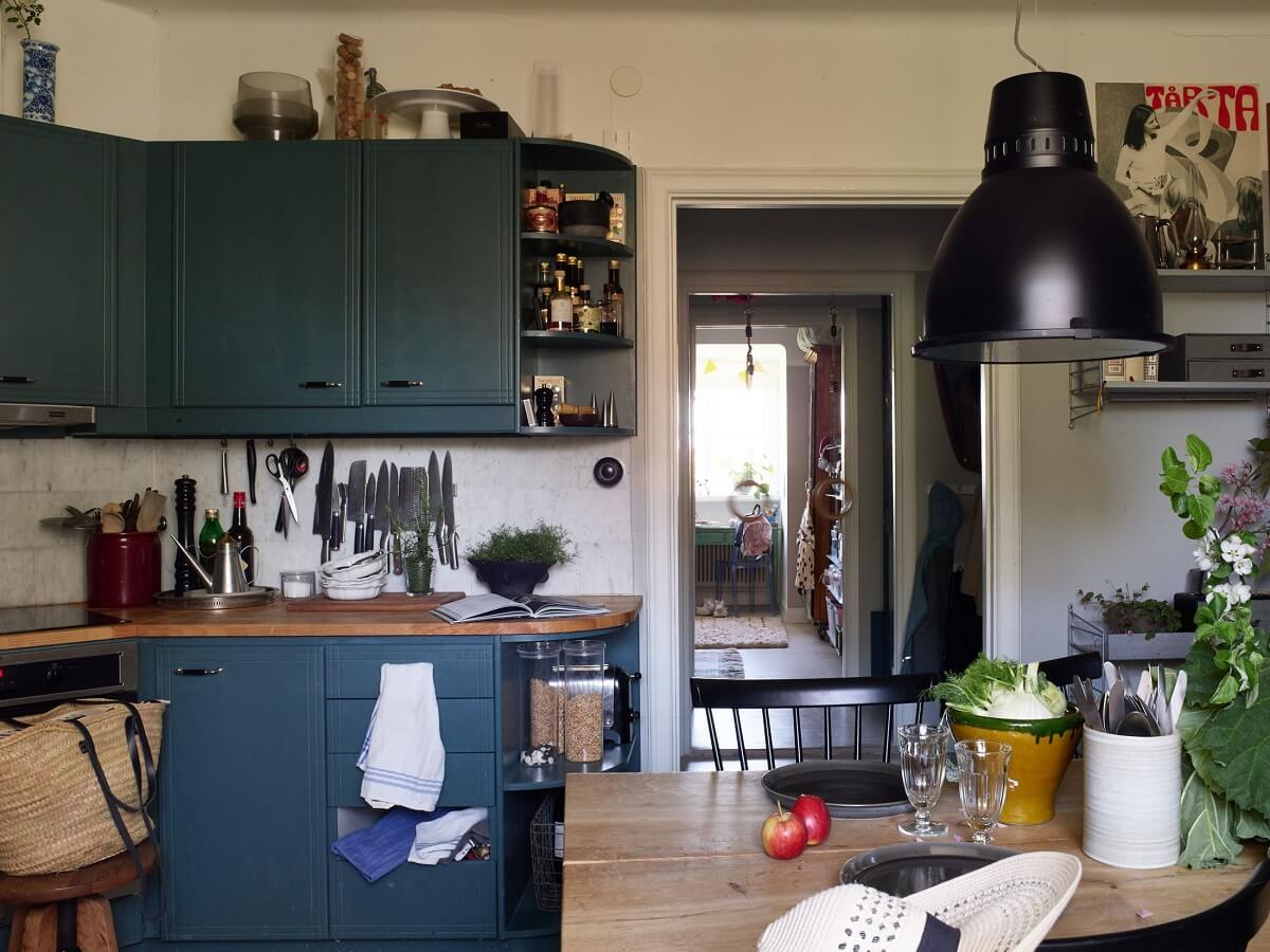 A Cozy Attic Apartment is a Charming Family Home 16 cozy kitchen blue cabinets