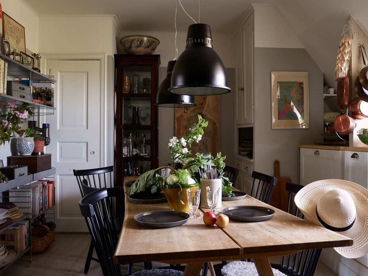 A Cozy Attic Apartment is a Charming Family Home 17 cozy kitchen with dining table in the center