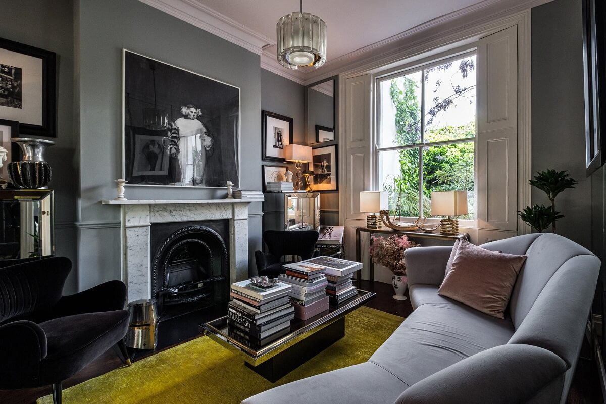 Moody Gray Tones and Period Details in a Victorian Townhouse 2 cozy living room gray walls fireplace ochre rug