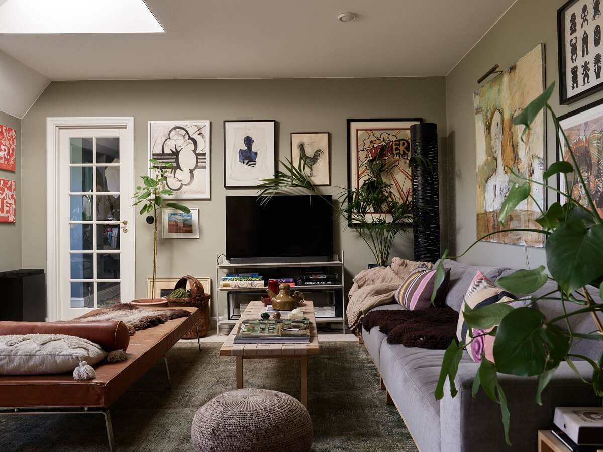A Cozy Attic Apartment is a Charming Family Home 2 cozy living room with art on the walls