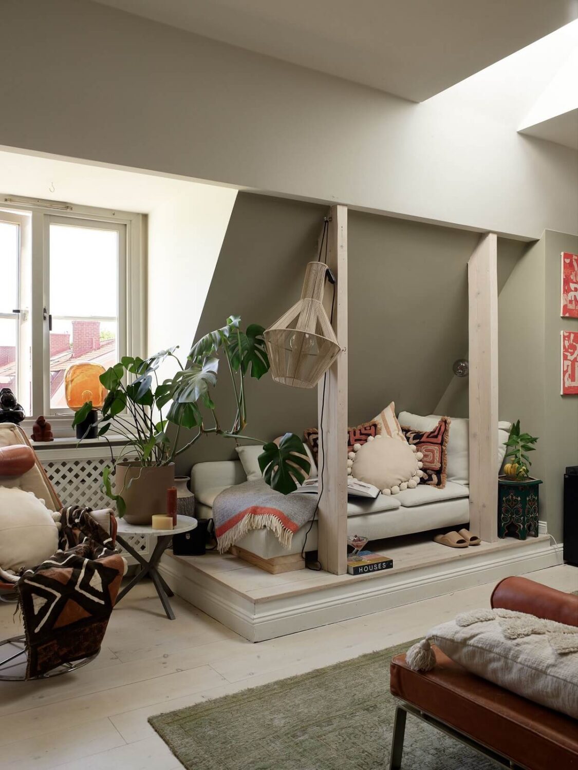A Cozy Attic Apartment is a Charming Family Home 4 cozy living room with seating nook under slanted ceiling
