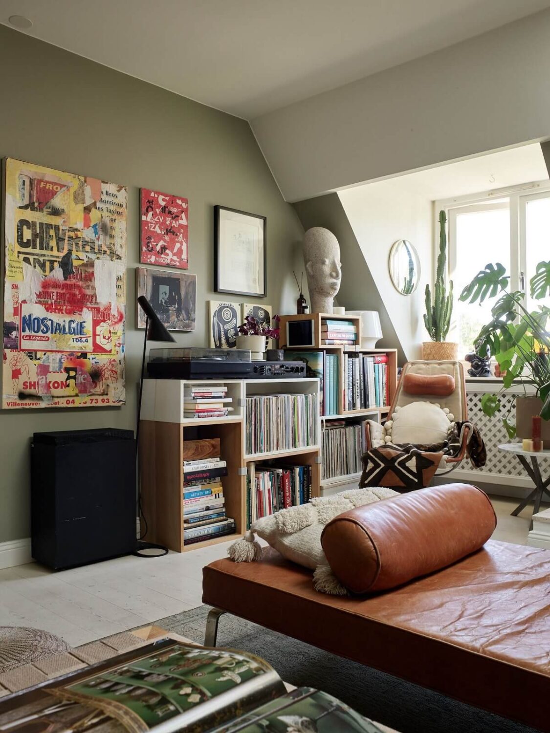 A Cozy Attic Apartment is a Charming Family Home 6 cozy living room with slanted ceiling and music storage