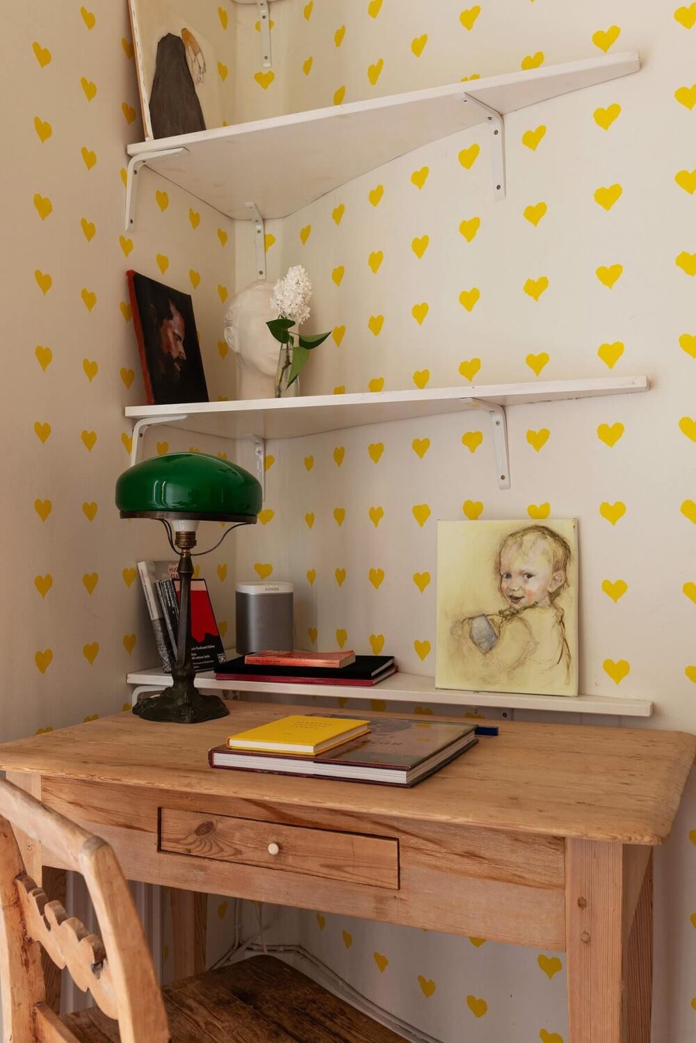 Light and Charming Rooms in a Historic Stockholm Apartment 16 desk and shelves with yellow heart wallpaper