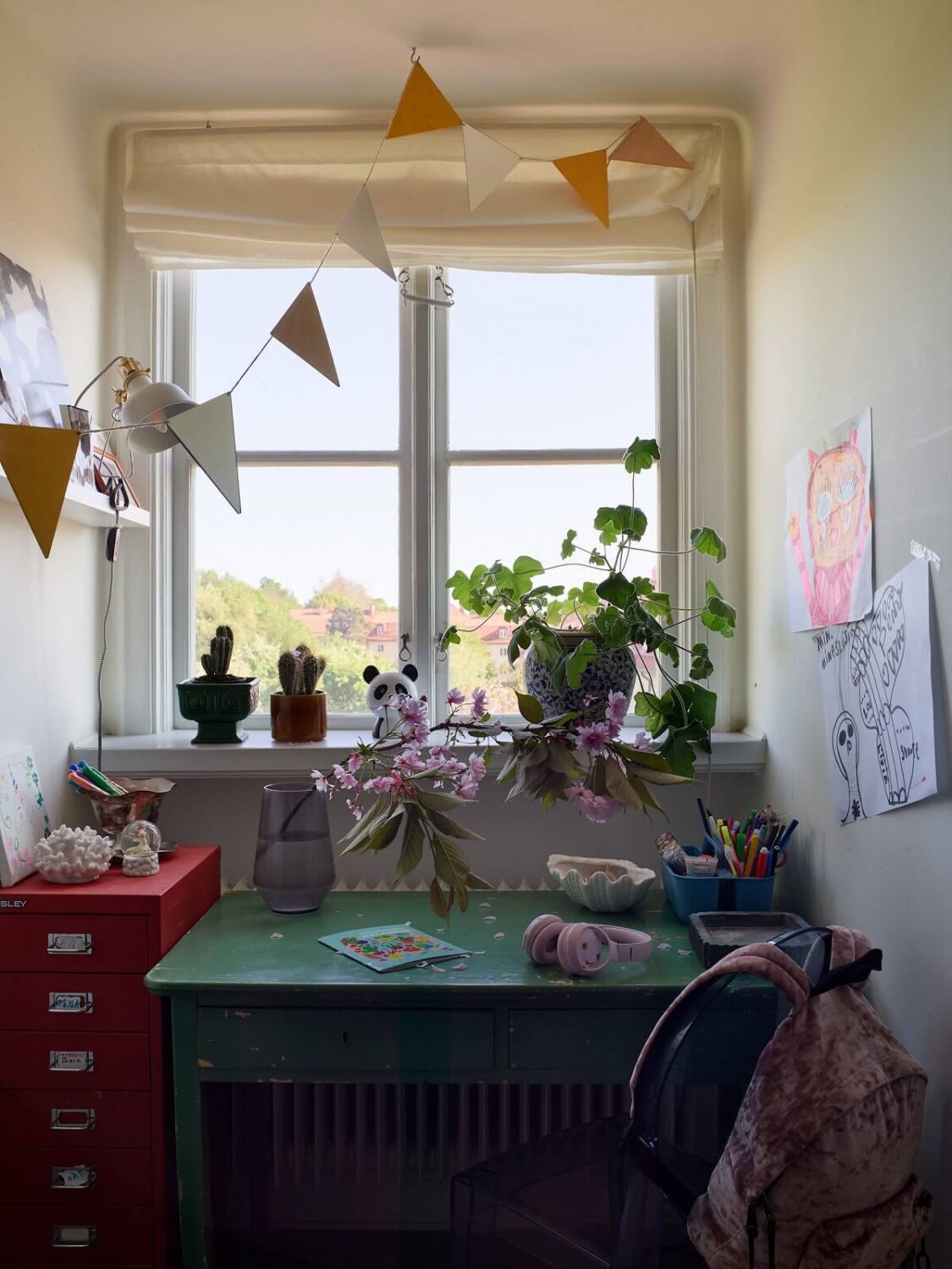 A Cozy Attic Apartment is a Charming Family Home 21 desk under window children room