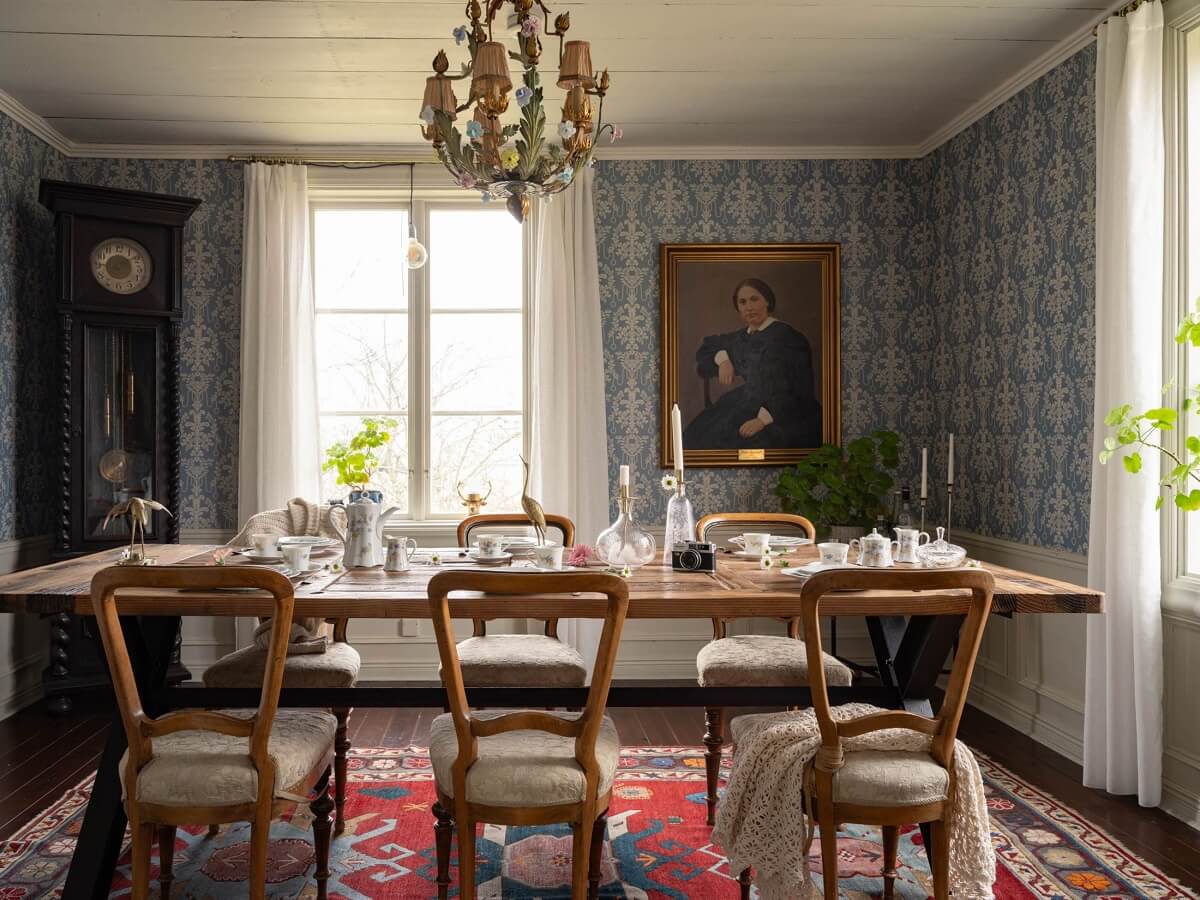 Original Character and Grand Rooms in a Swedish Country House 6 dining room wooden table blue wallpaper
