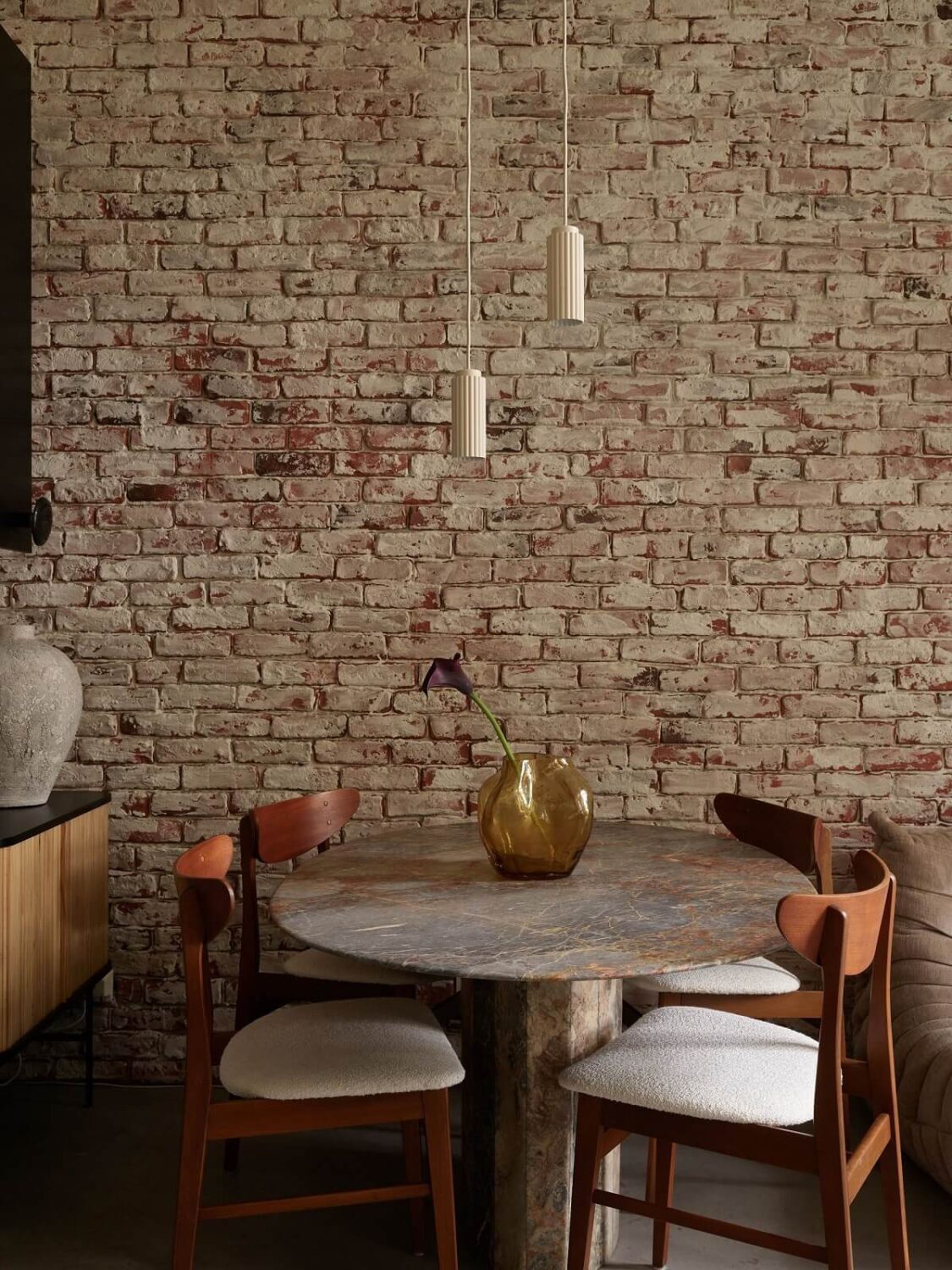New York Vibes in a Stylish Stockholm Apartment 13 dining space brick wall