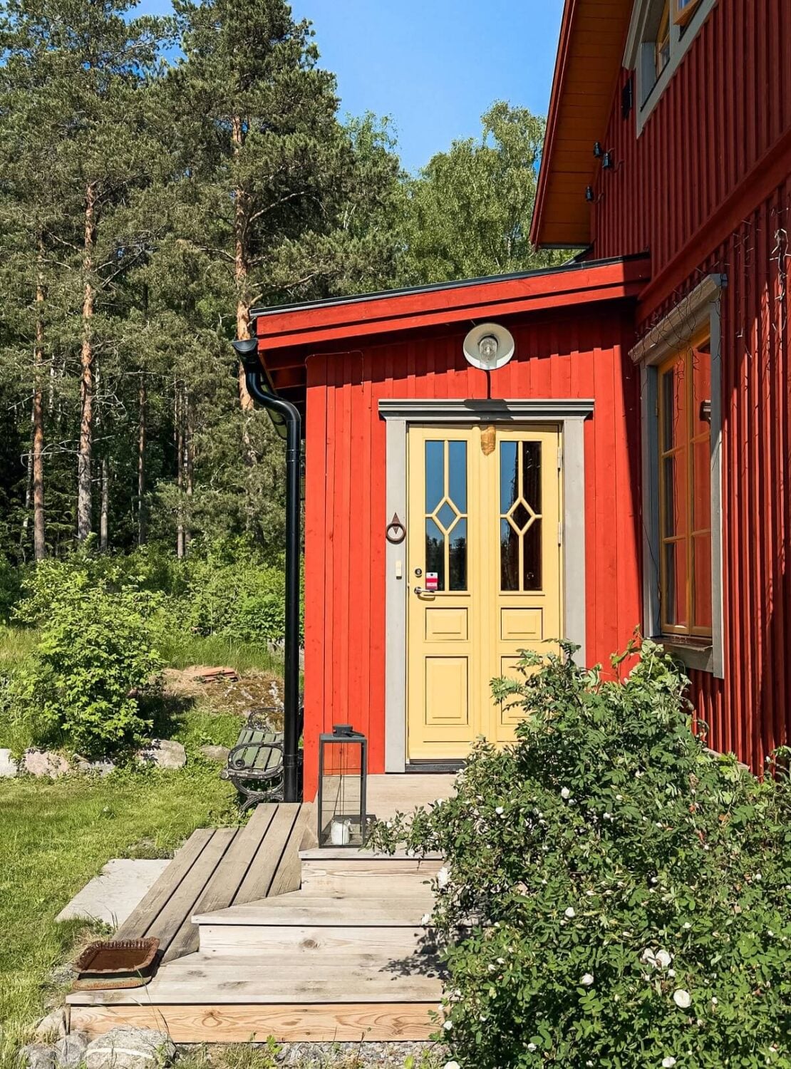 A Charming Historic Home with Views of the Lake 11 front door red wooden swedish house
