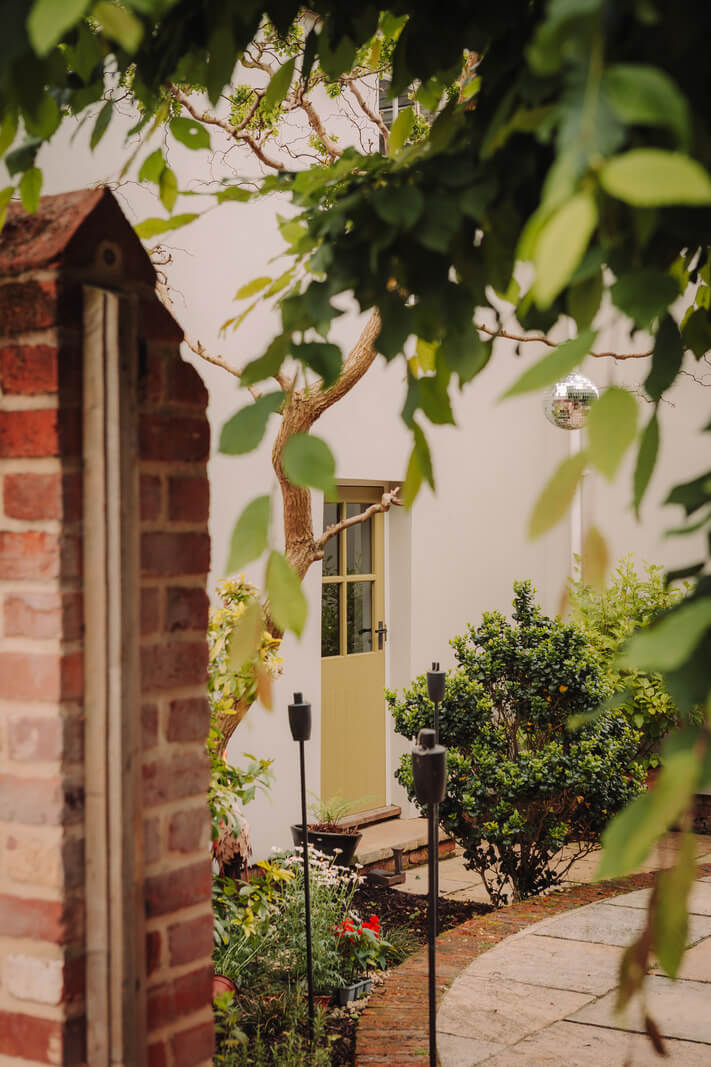 Colorful Rooms in an Elegant Georgian Home in England 23 garden yellow front door
