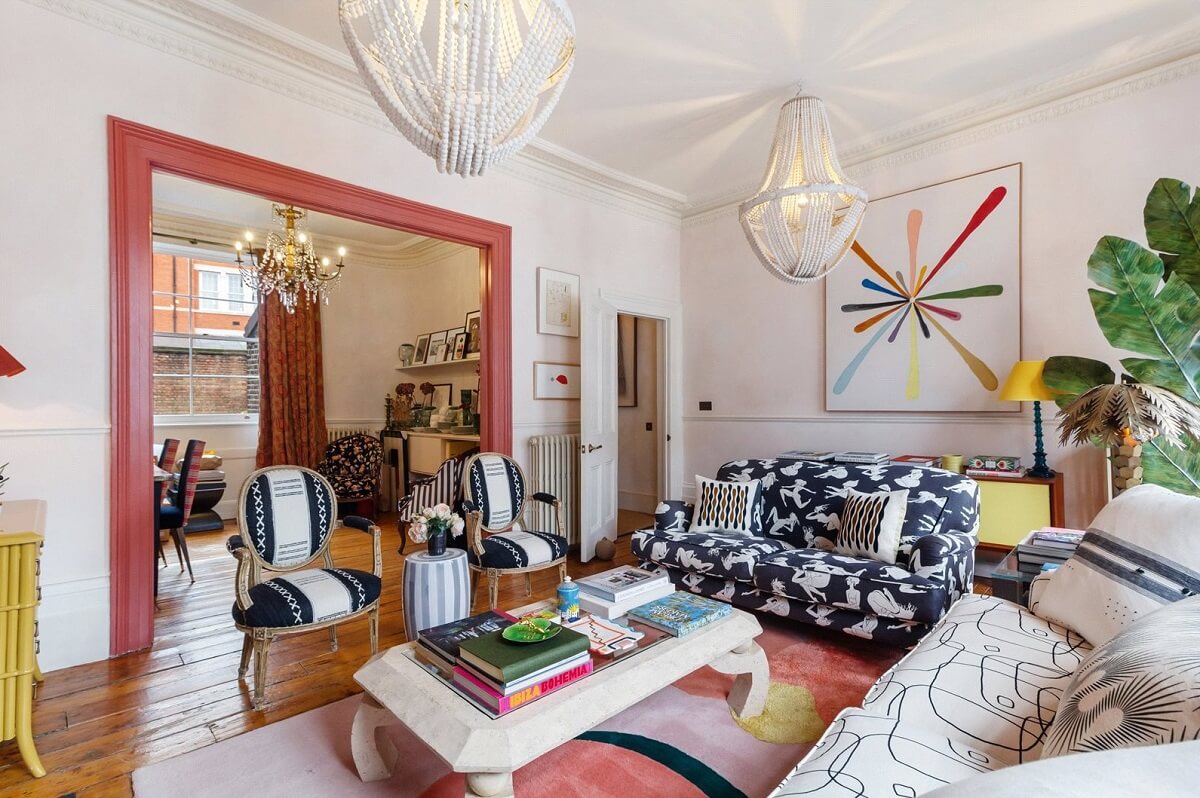 Limewash Paint and Artisan Wallpaper in a London Townhouse 5 graphic sofas colorful rug and pink woodwork living room