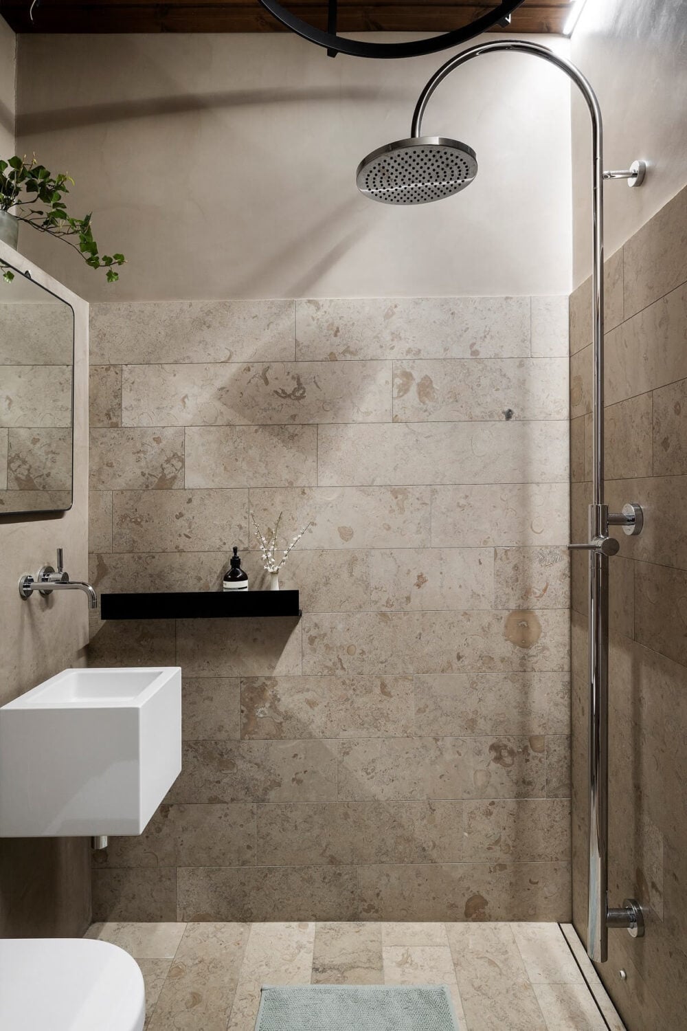 A Stylish Scandinavian Duplex with Custom-Made Cabinets 25 gray bathroom