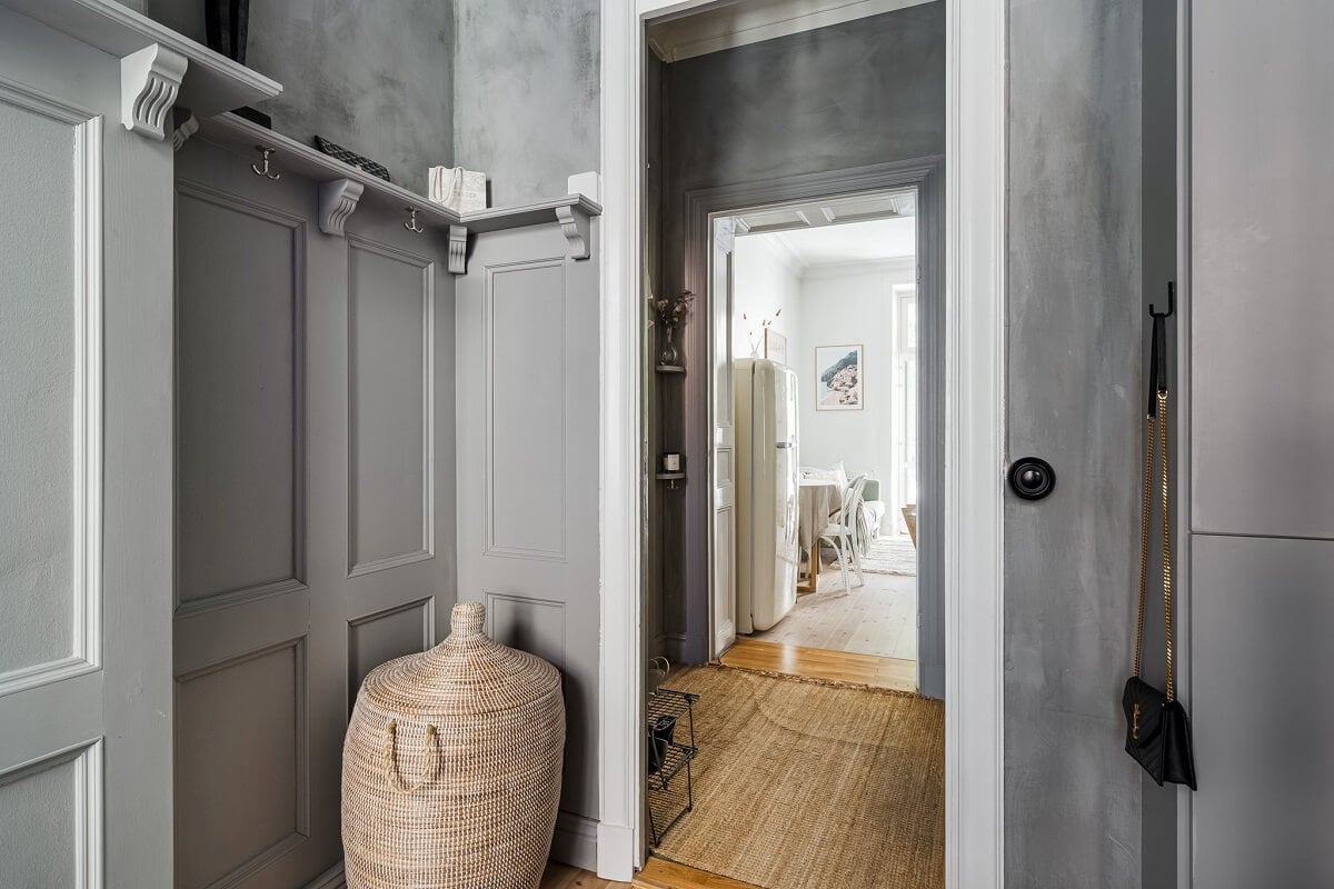 A Small Stockholm Apartment with a Gray Bedroom & Sunny Balcony 12 gray hallway