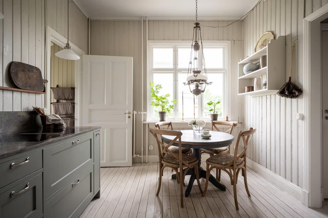 Original Charm in a Light Green Swedish Country House 12 gray kitchen with round wooden table