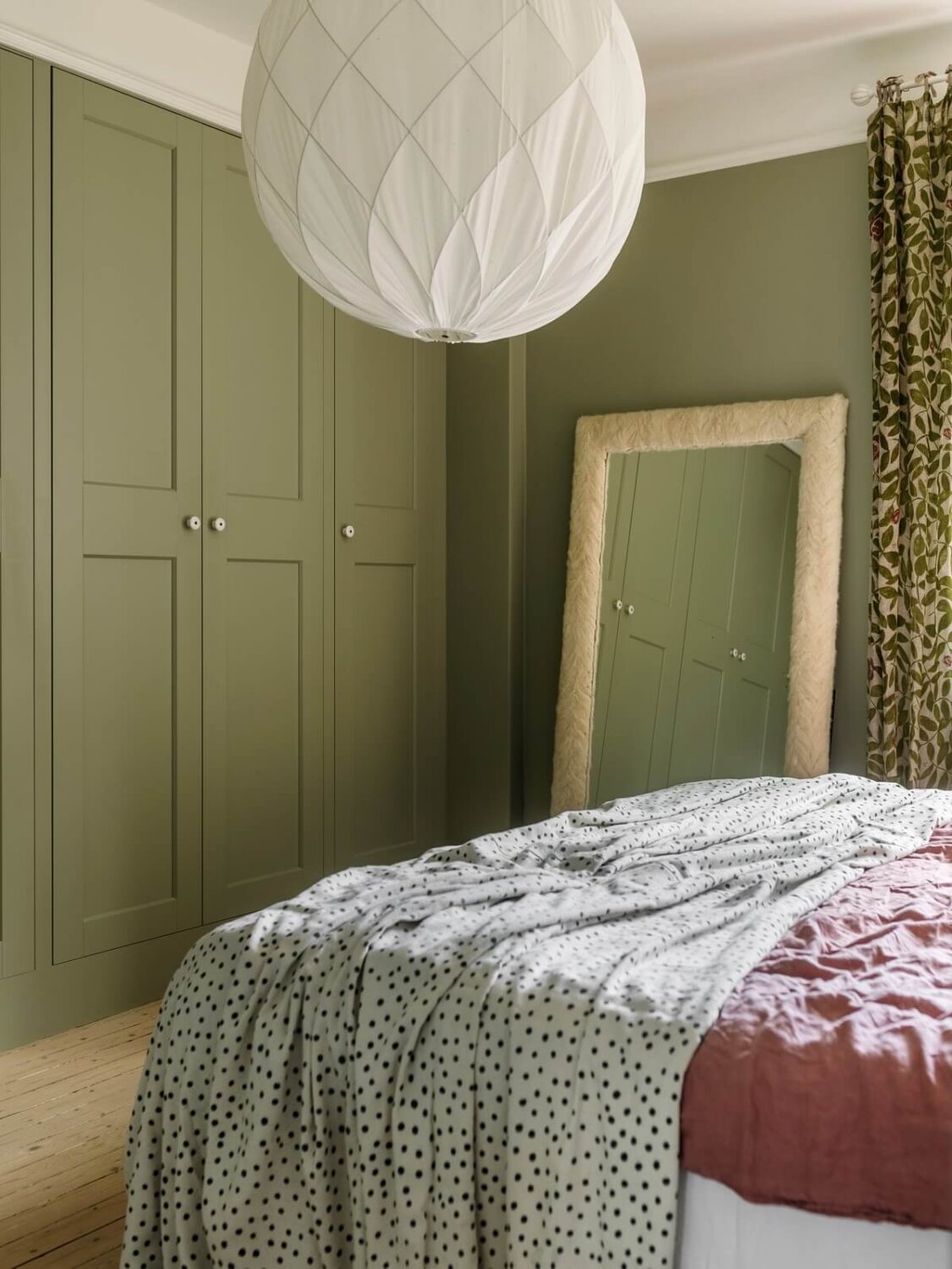 A Light Atmosphere and Wallpapers in a Swedish Apartment 17 green bedroom with built in wardrobes nordroom