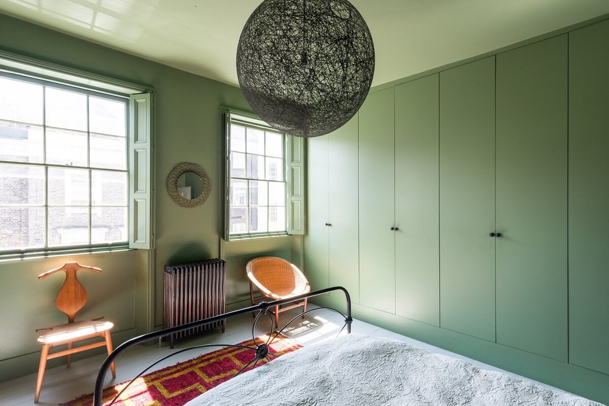 Heritage Colors and Original Details in a London Townhouse 19 green bedroom with built in wardrobes
