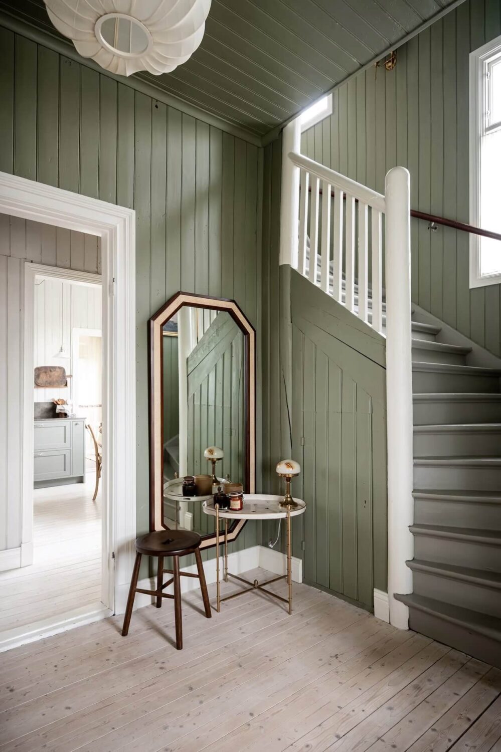 Original Charm in a Light Green Swedish Country House 14 green hall with staircase