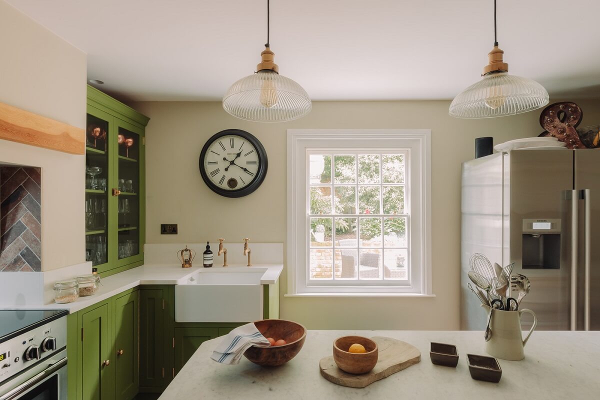 Colorful Rooms in an Elegant Georgian Home in England 5 green kitchen cabinets