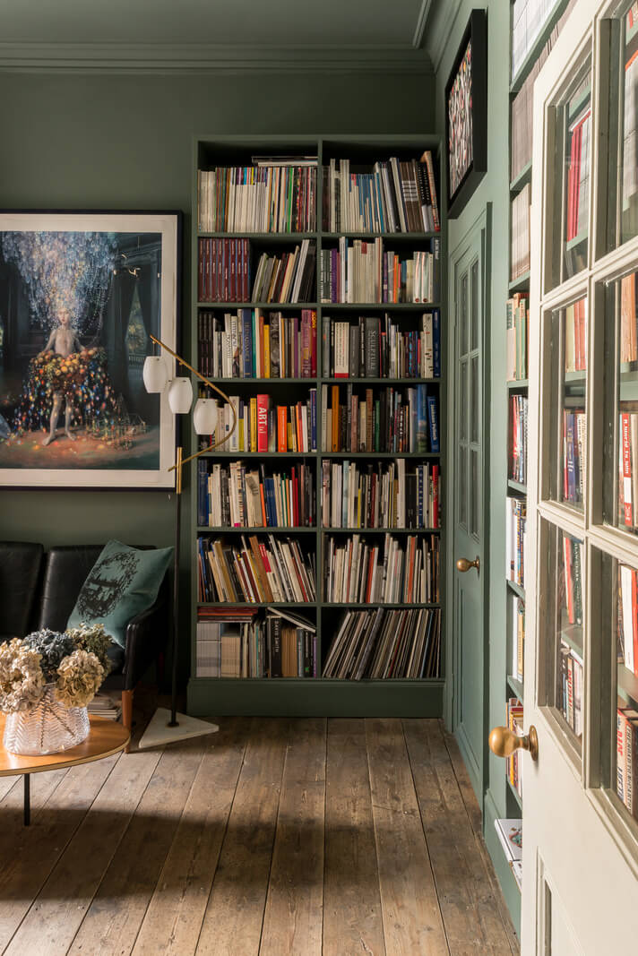 Heritage Colors and Original Details in a London Townhouse 8 green living room with bookcases