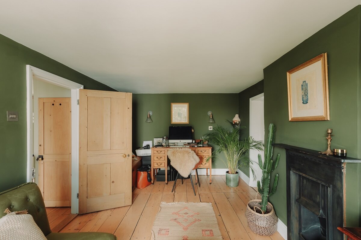 Colorful Rooms in an Elegant Georgian Home in England 14 green living room with fireplace and desk