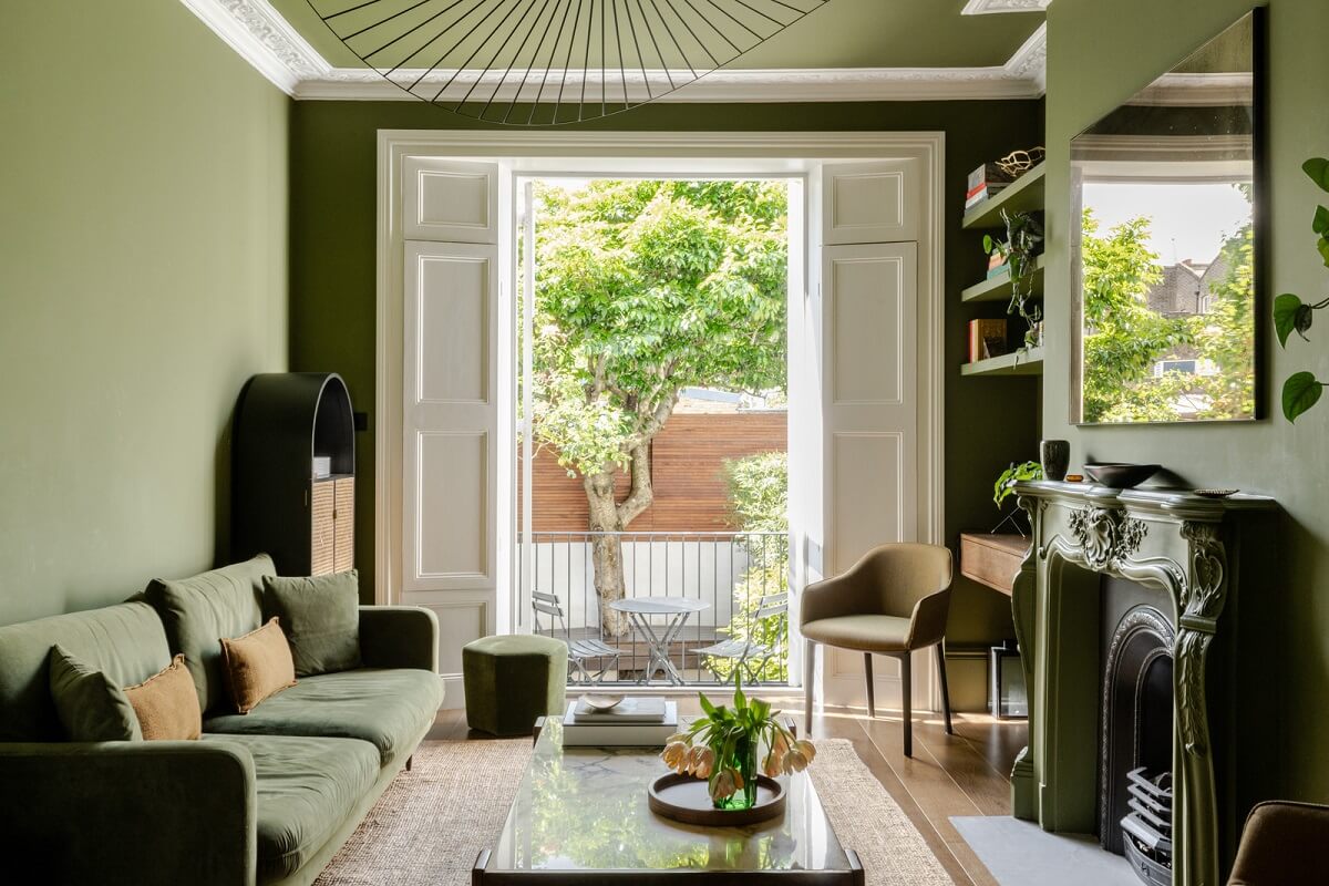 A Green Living Room in a London Maisonette 1 green living room with fireplace and shelves