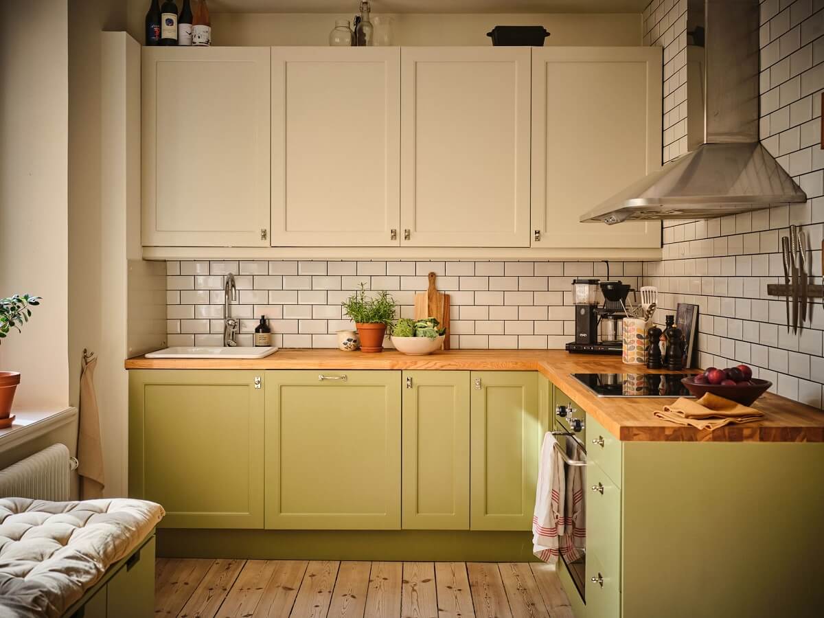 A Light Apartment with a Sage Green Kitchen 7 green white kitchen cabinets A Light Apartment with a Sage Green Kitchen