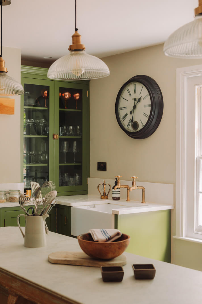 Colorful Rooms in an Elegant Georgian Home in England 6 gren kitchen with glass cabinet