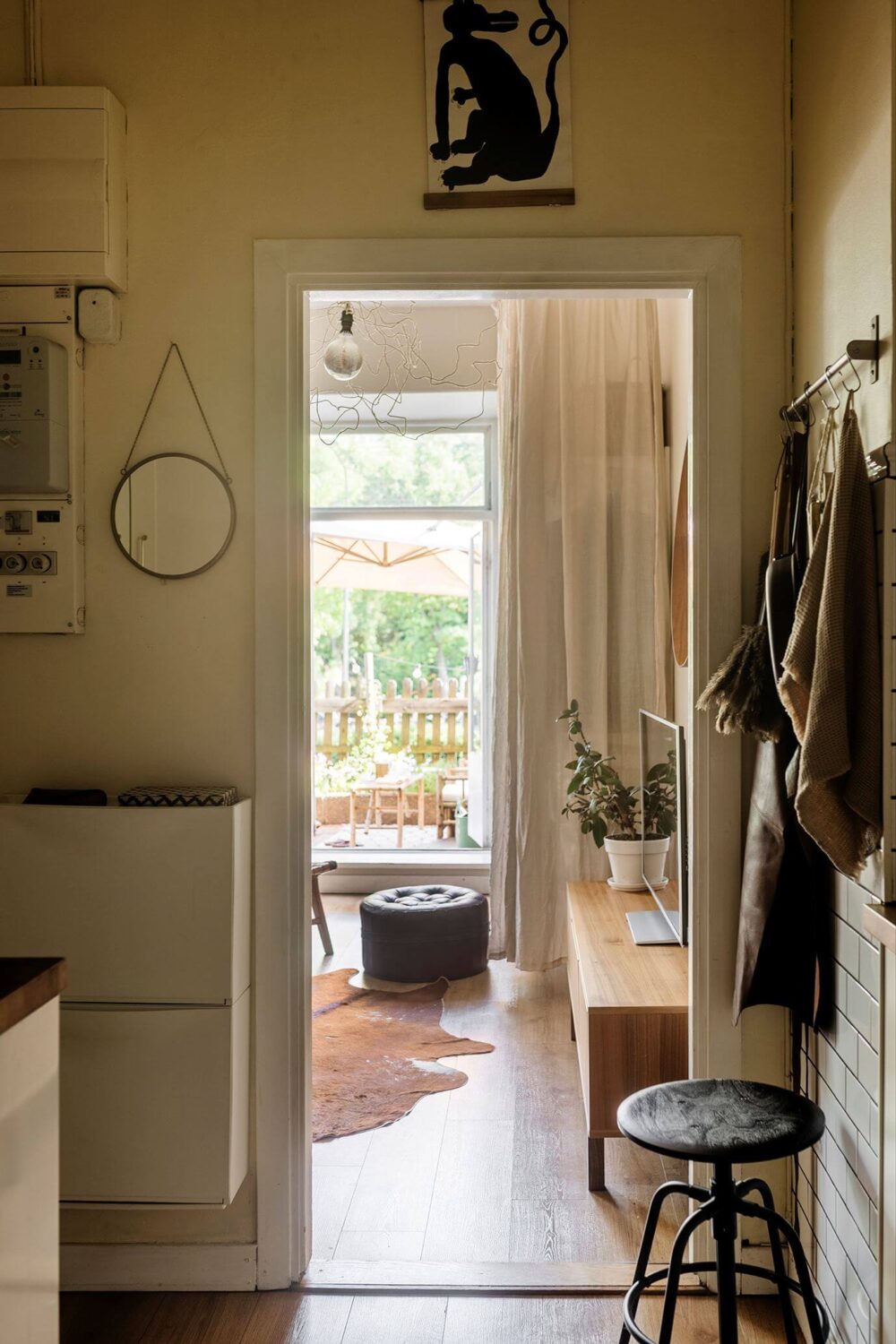 A Charming Studio Apartment with a Loft Bed 12 hallway view into studio