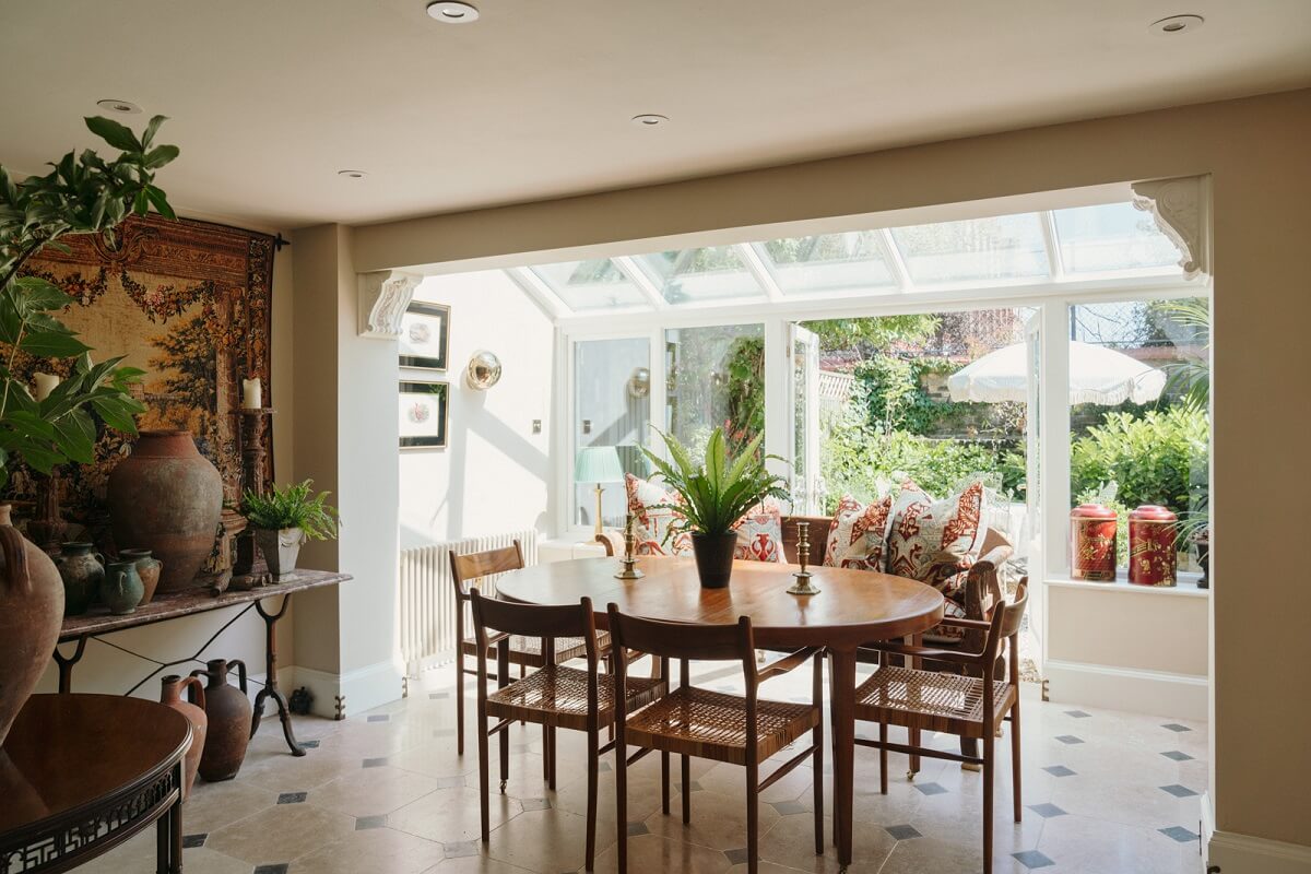 Rich Colors and Patterns in a London Townhouse 5 kitchen dining space with extended sunroom
