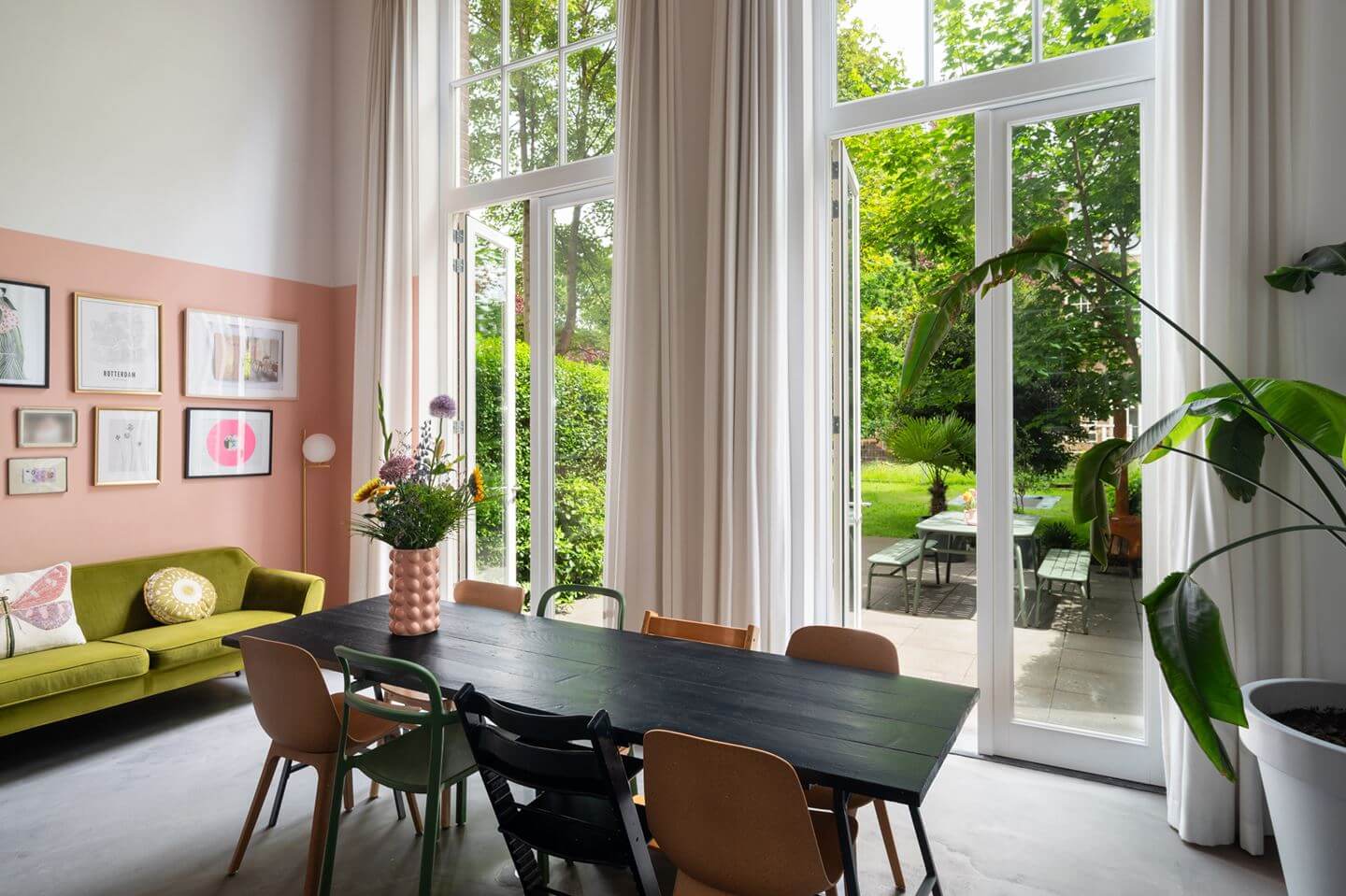 Loft Spaces in a Former School Conversion in Rotterdam 6 kitchen dining table half painted wall