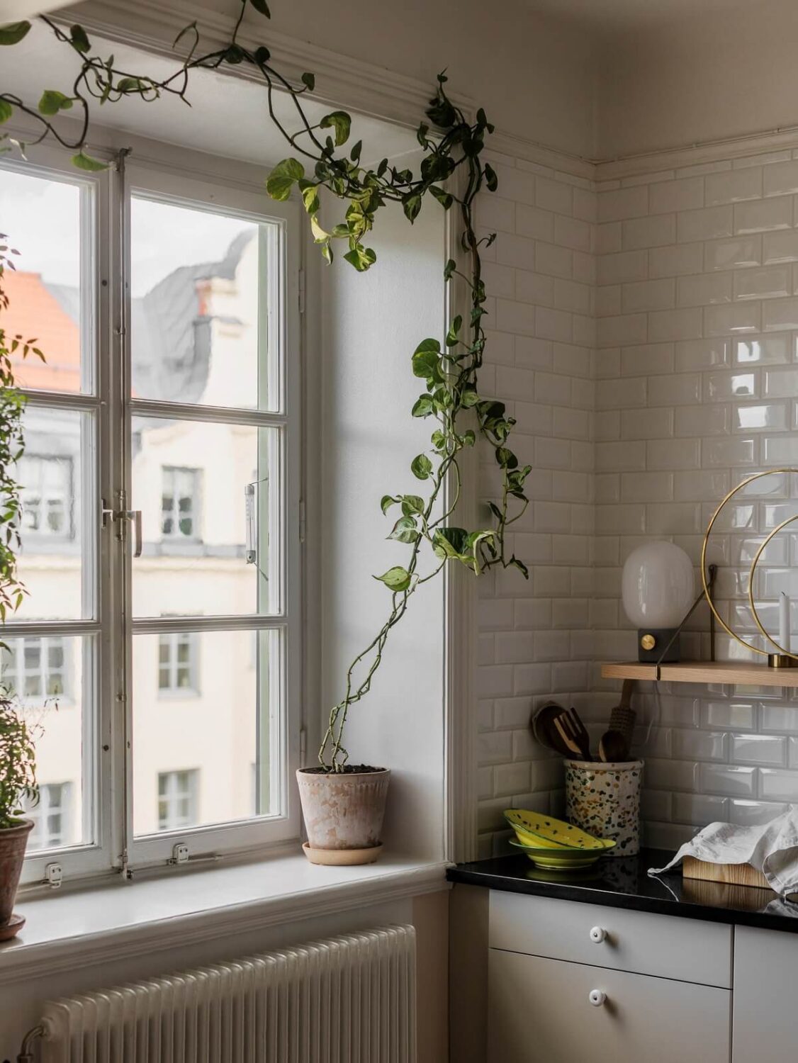 A Light Atmosphere and Wallpapers in a Swedish Apartment 8 kitchen window